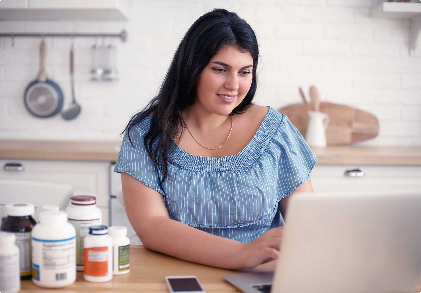 Latin Woman accessing Telehealth