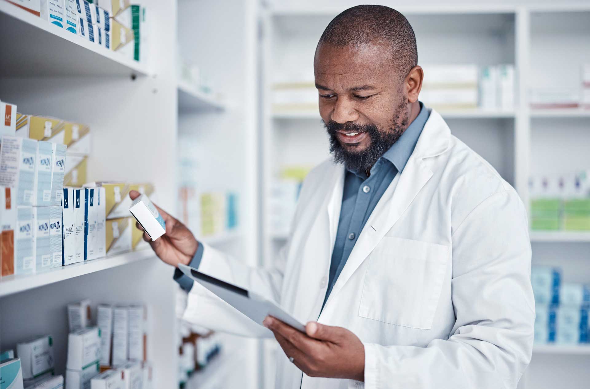 pharmacist - Recuro Health | Making Advanced Healthcare Accessible™ Pharmacist reviewing medications